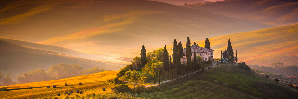 cottage in the Tuscany hills at sunset